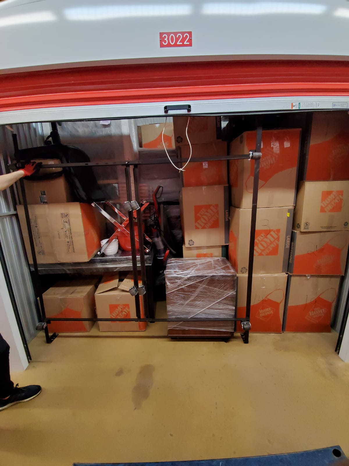 alt="A storage filled with boxes and furniture"